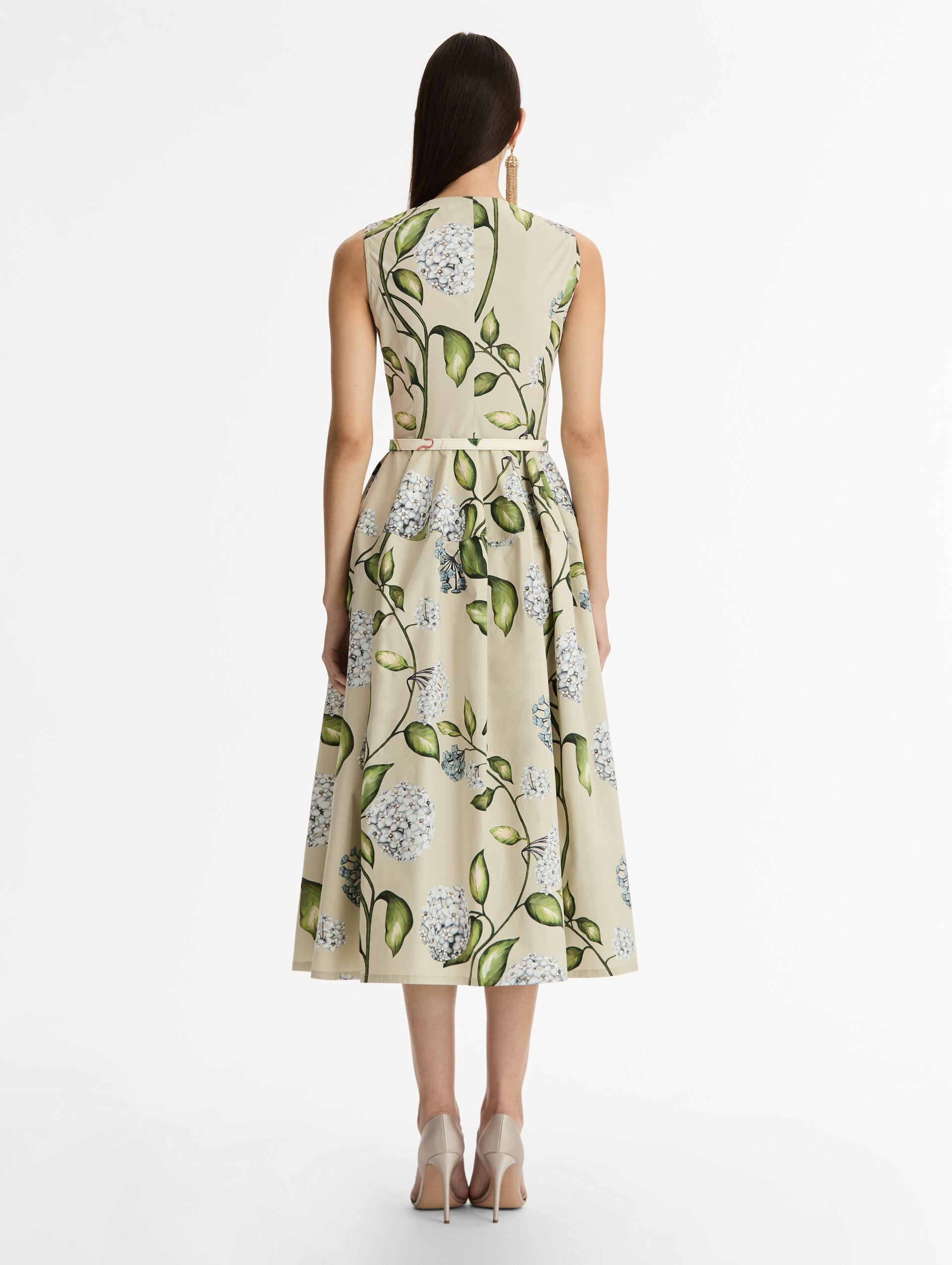 Porcelain Flower Cotton Poplin Dress This cotton poplin dress. Clean, sculpted lines. Relaxed, mid-length silhouette. with cinching matching self-belt at the waist. Back View.