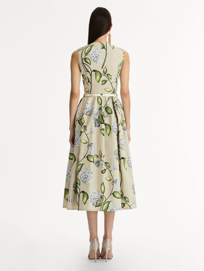 Porcelain Flower Cotton Poplin Dress This cotton poplin dress. Clean, sculpted lines. Relaxed, mid-length silhouette. with cinching matching self-belt at the waist. Back View.