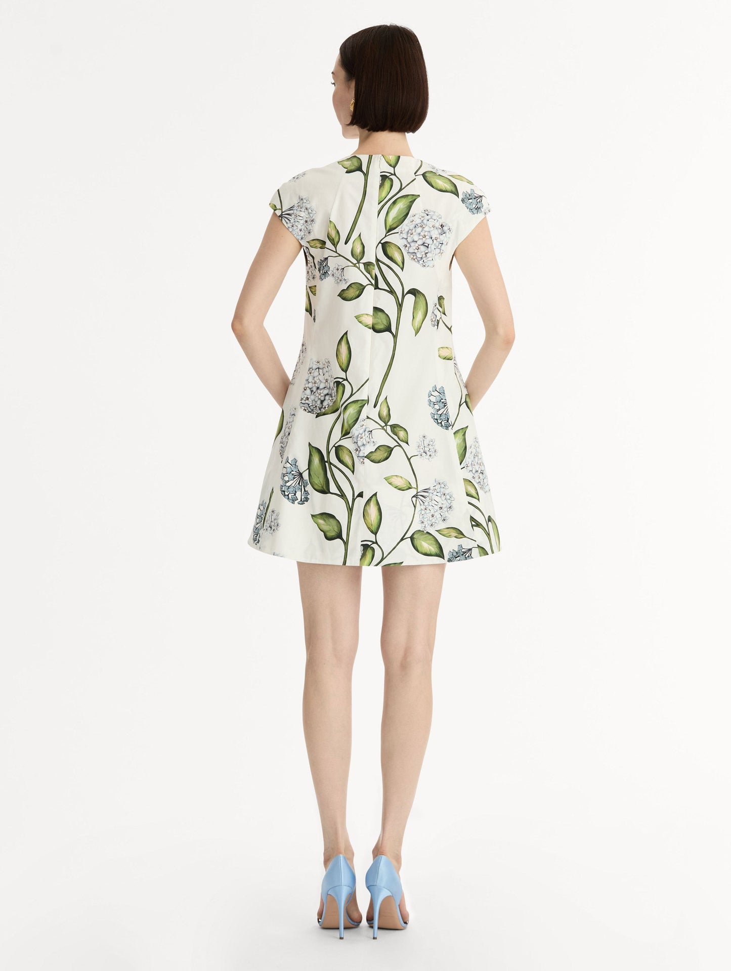 Porcelain Flower Cotton Poplin A-Line Mini Dress. Short Sleeves. Blue and Green Floral Motif. Back View.