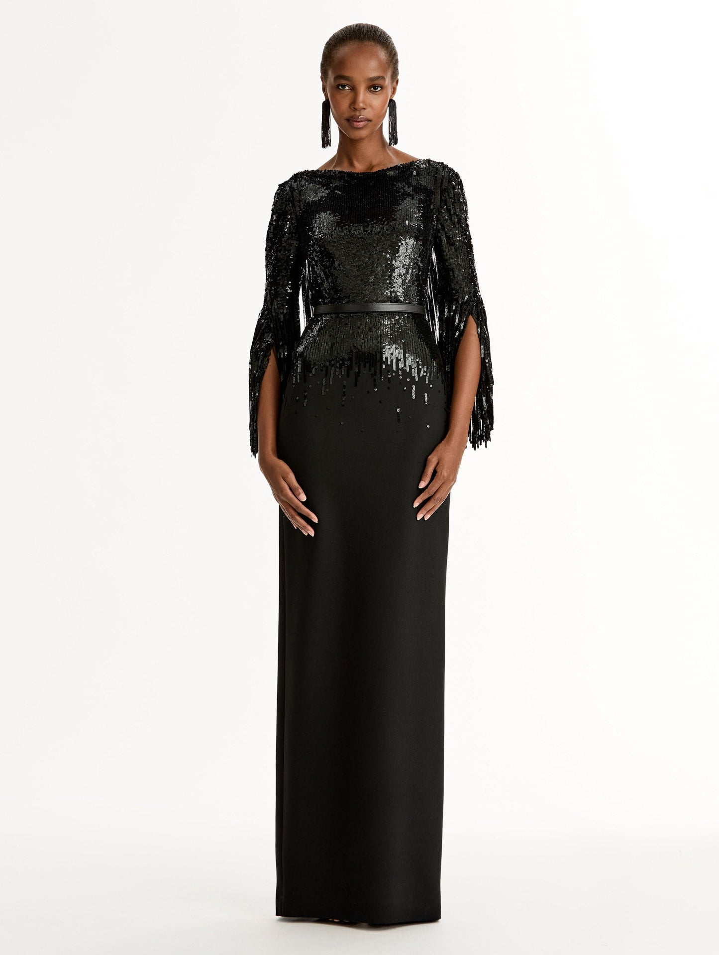 Black Sequin, Floor length gown in double-faced stretch wool. Open sleeves with beaded fringe. Front View.