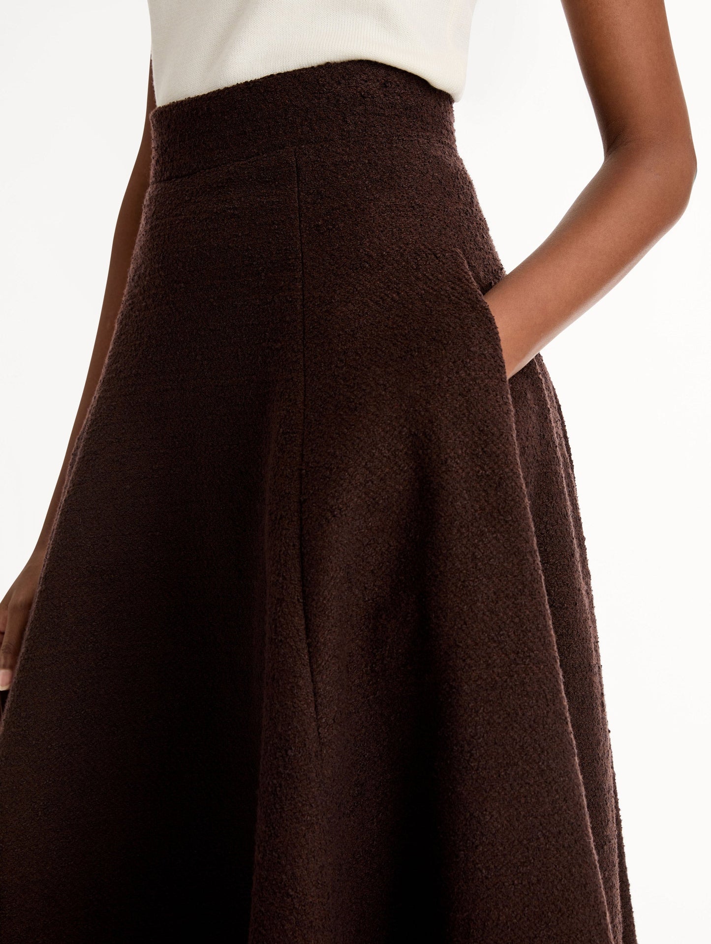 Chocolate Wool Tweed Pleated Skirt with Pockets. High-waisted with Flared Fit. Side View, Close Up.
