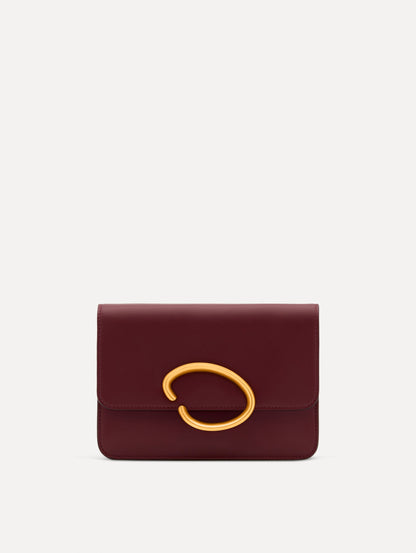 Maroon O Pochette with gold hardware and abstract O Clasp. Front View.