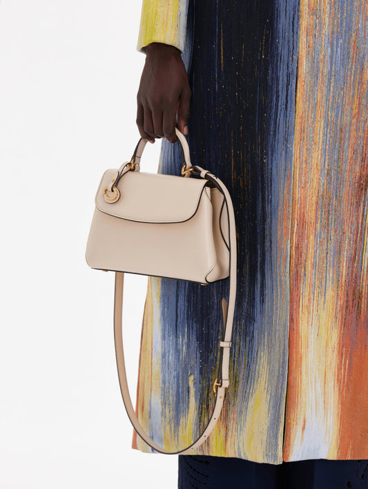 Small Leather Handbag in Ivory with Removable Shoulder Strap and Top Handle with Oscar O Logo Attached. Front View