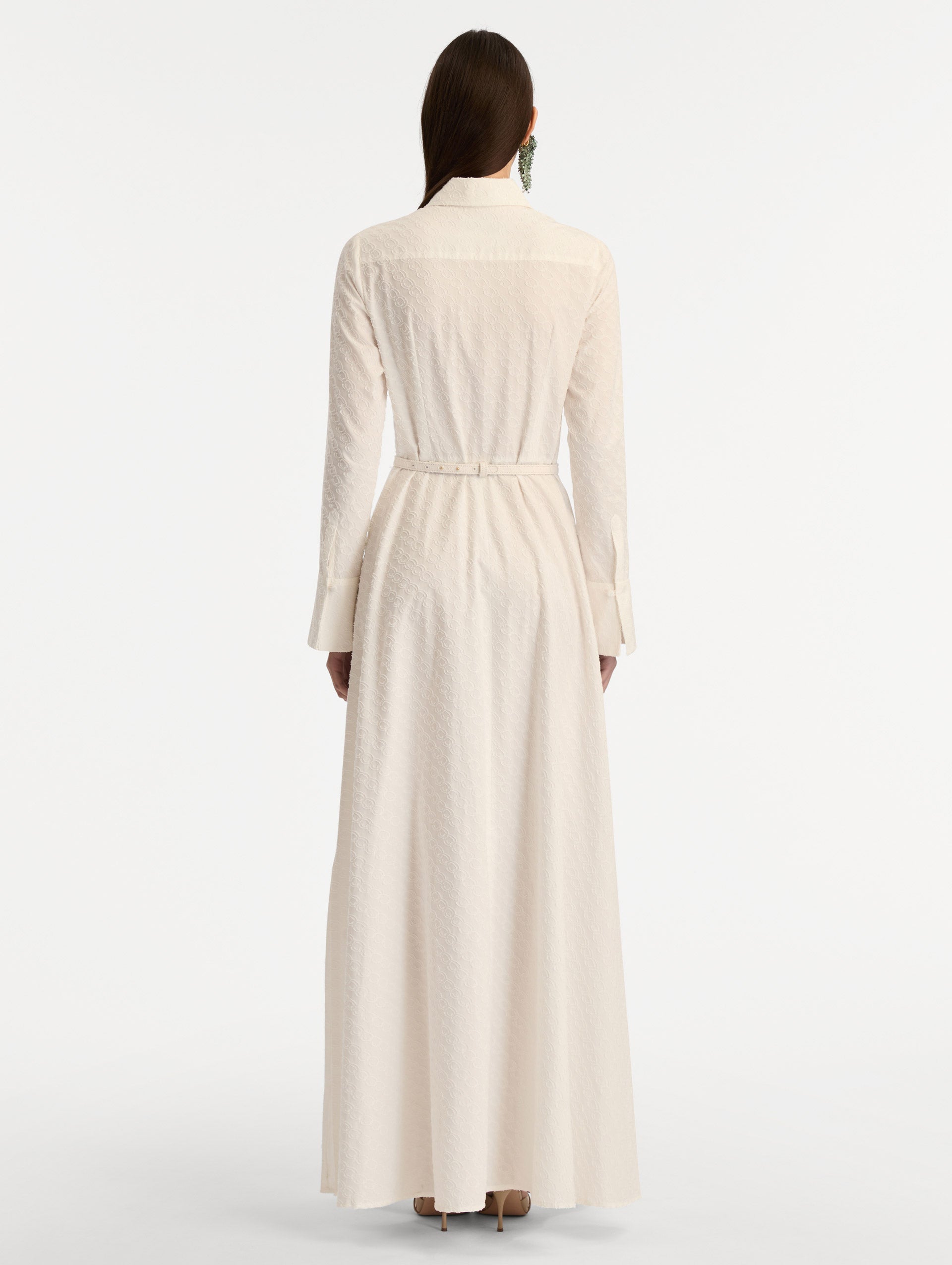 Ivory Oscar Chain-Link Cotton Poplin Caftan featuring a collared neckline, flared sleeves, gold button front, and belted waist with floral buckle. Back View.