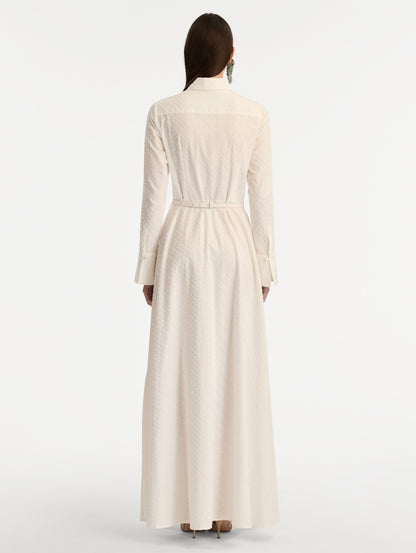 Ivory Oscar Chain-Link Cotton Poplin Caftan featuring a collared neckline, flared sleeves, gold button front, and belted waist with floral buckle. Back View.