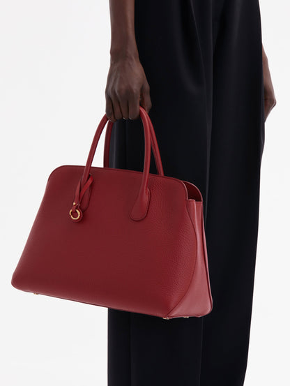 The Ivy bag in Scarlet, front view with shoulder strap showing and Oscar O logo around the Top handle.