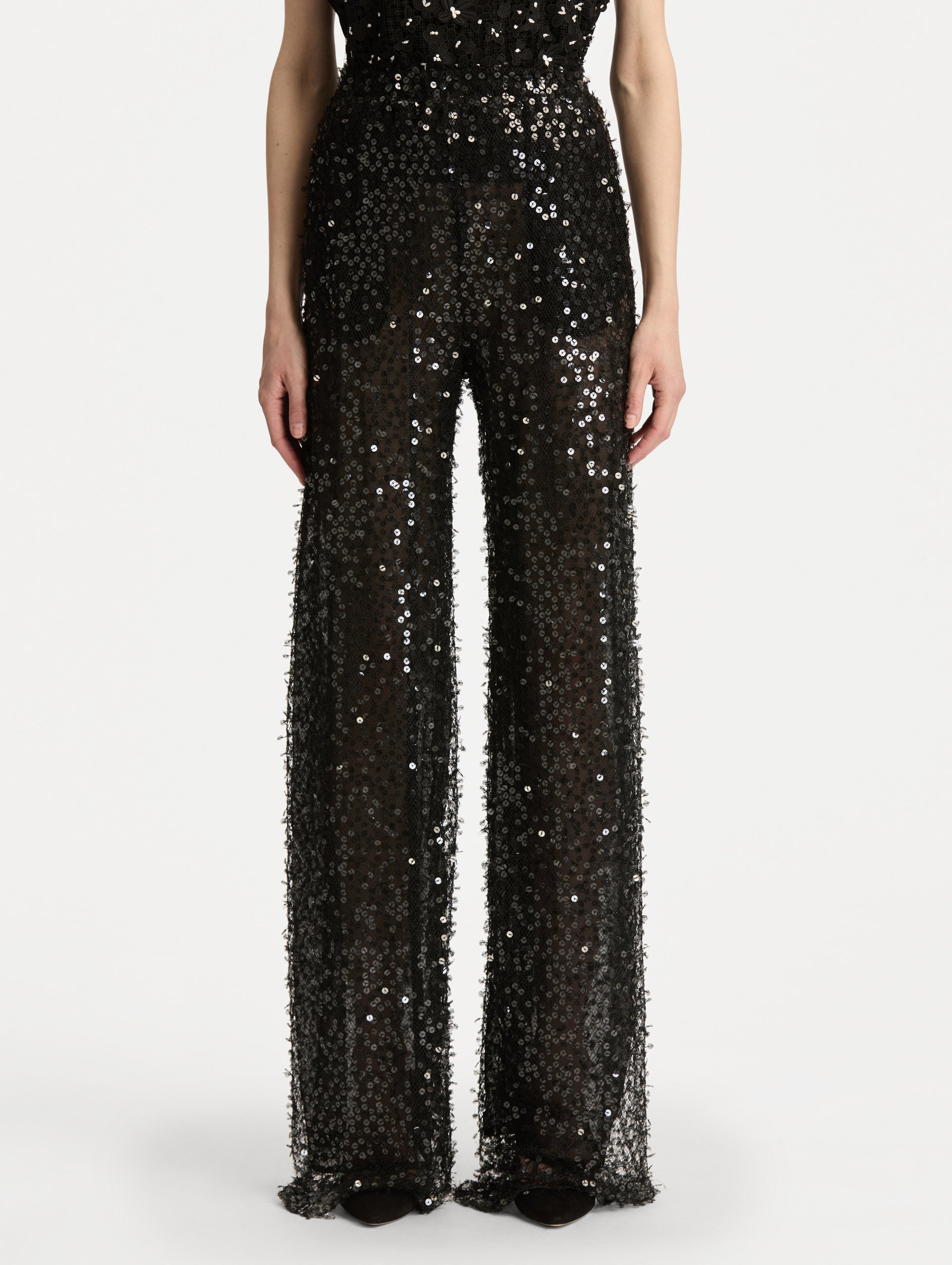 Black Floating Sequin Pant with high waist and wide leg silhouette. Front View.