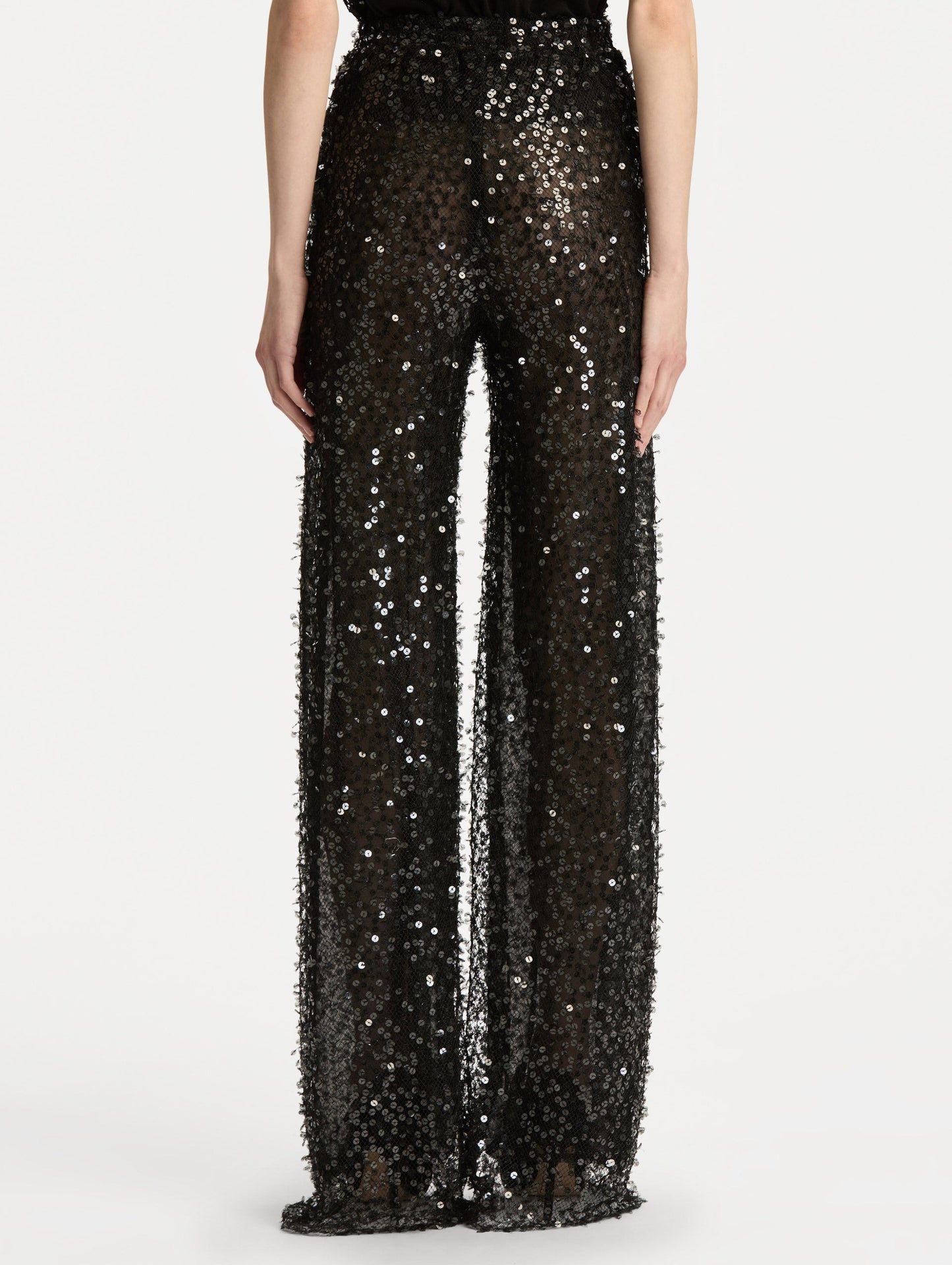 Black Floating Sequin Pant with high waist and wide leg silhouette. Back View.
