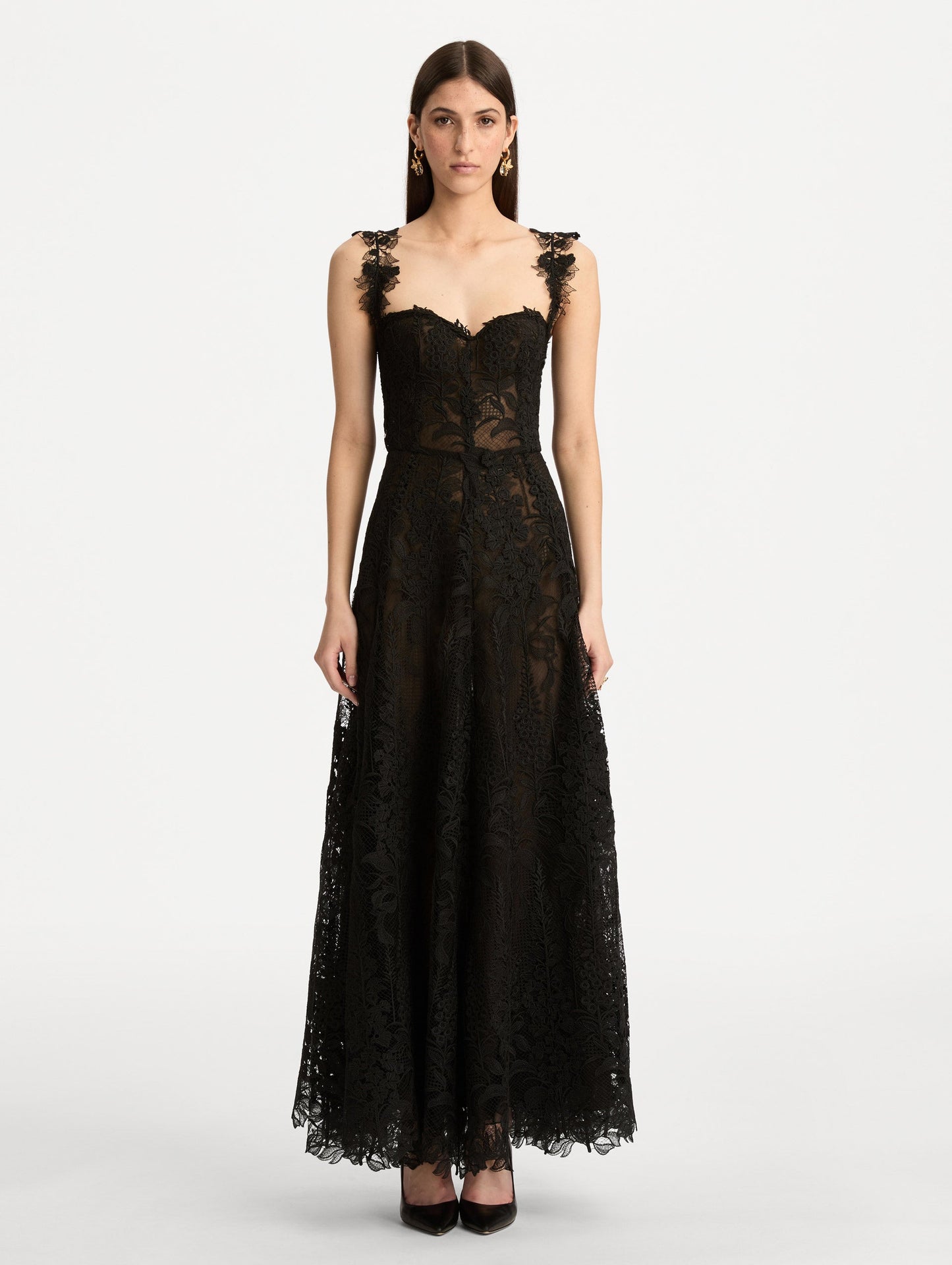 Black Foxglove Guipure Cocktail Dress featuring a fitted bodice with structured cups, lace straps, and a sheer lace overlay skirt. Front View.