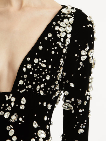 Zoomed in image of plunging V-neckline with scattered multi-dimensional stones.