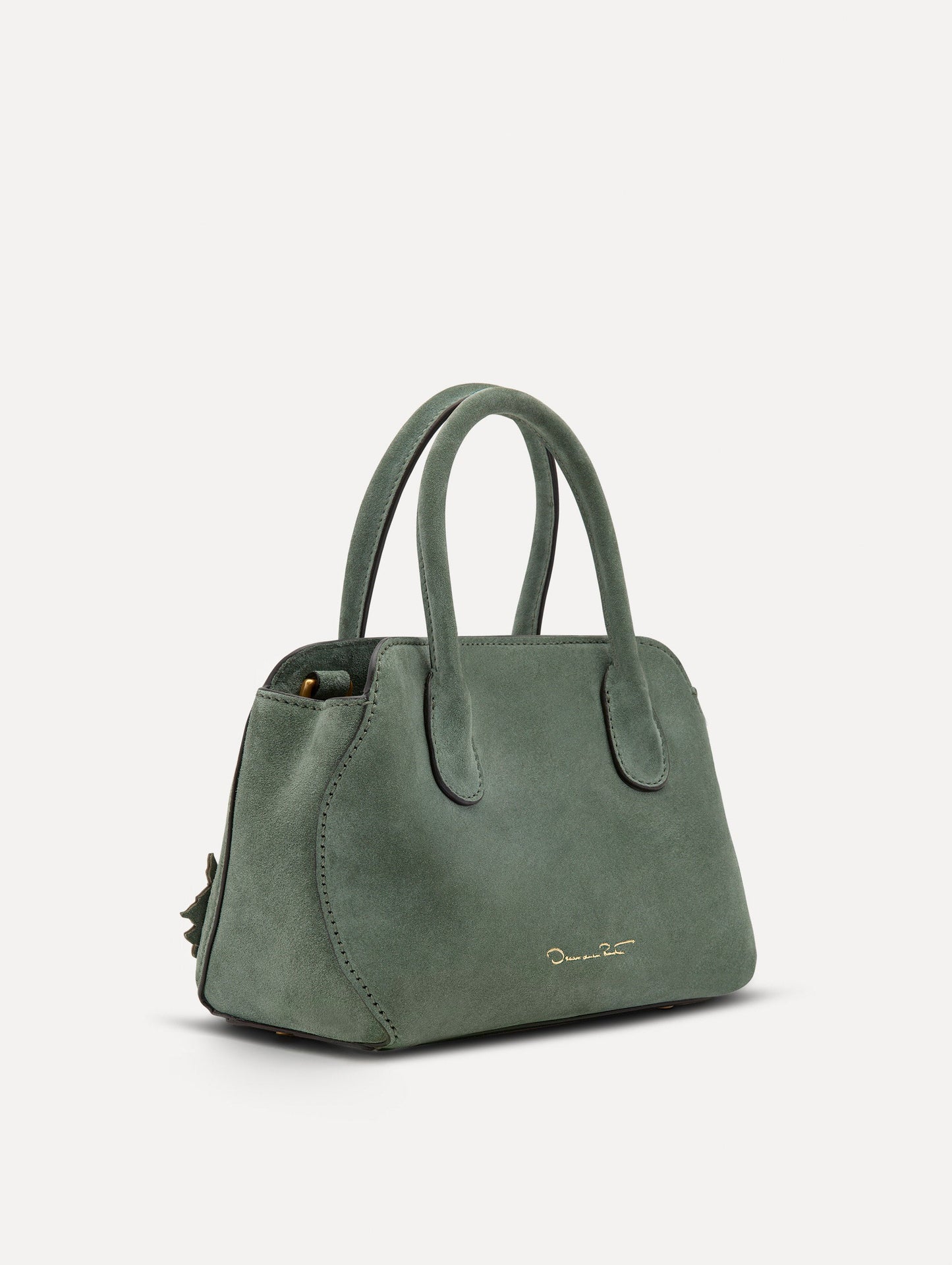Side view of The Mini Ivy With Laser Cut Flowers in sage which has a compartment with top handles with magnetic closure.