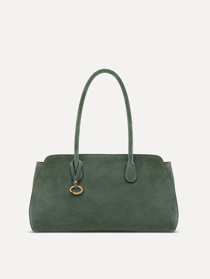 The Aster in sage has decisive lines and gently curved sides with the contours of the Oscar 'O.' Elongated top handles with gold hardware and an emblem-stamped tag.