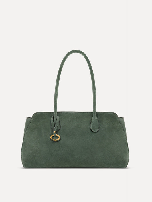 The Aster in sage has decisive lines and gently curved sides with the contours of the Oscar 'O.' Elongated top handles with gold hardware and an emblem-stamped tag.