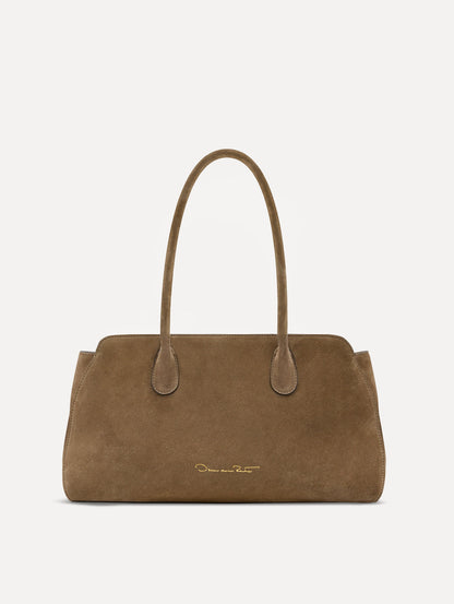 Back view of The Aster in taupe which features gently curved sides which mimic the Oscar 'O.' Elongated top handles with gold hardware and an emblem-stamped tag.