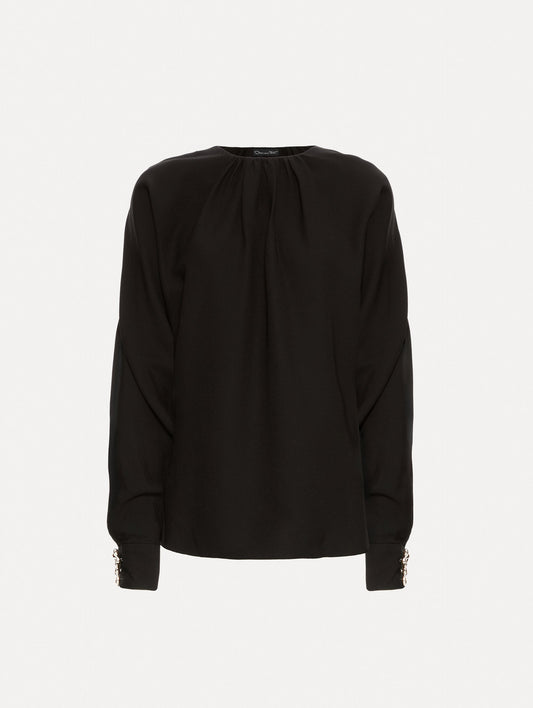 Black long sleeve top.