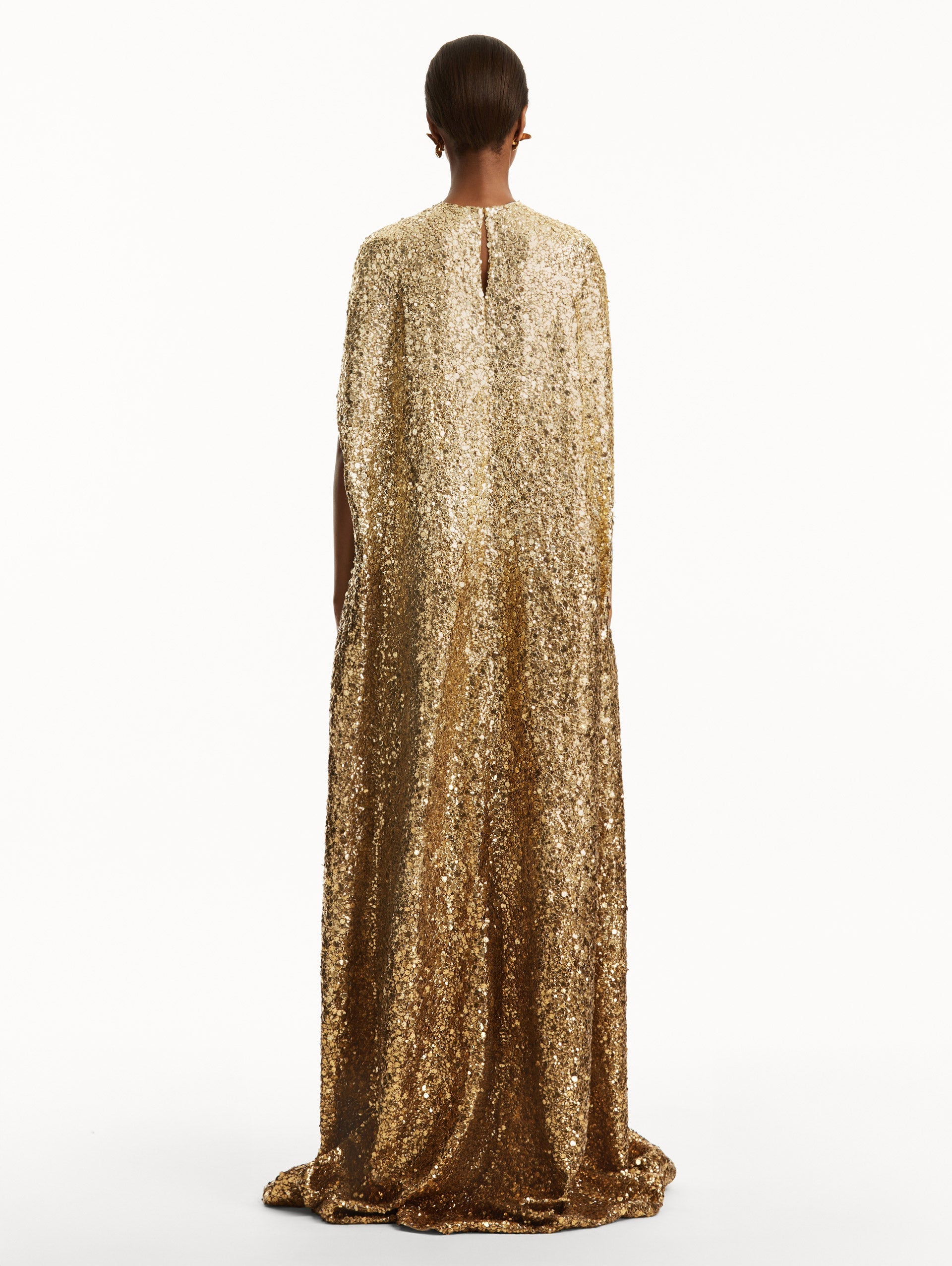 Model wearing ombre gold sequin embroidered caftan. Back view
