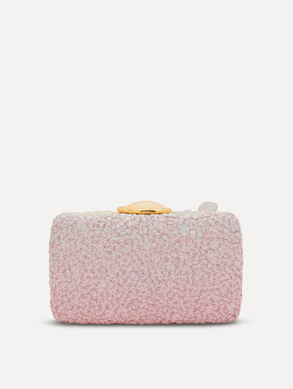A clutch embellished with pink stones and three-dimensional white flowers attached. Back view.
