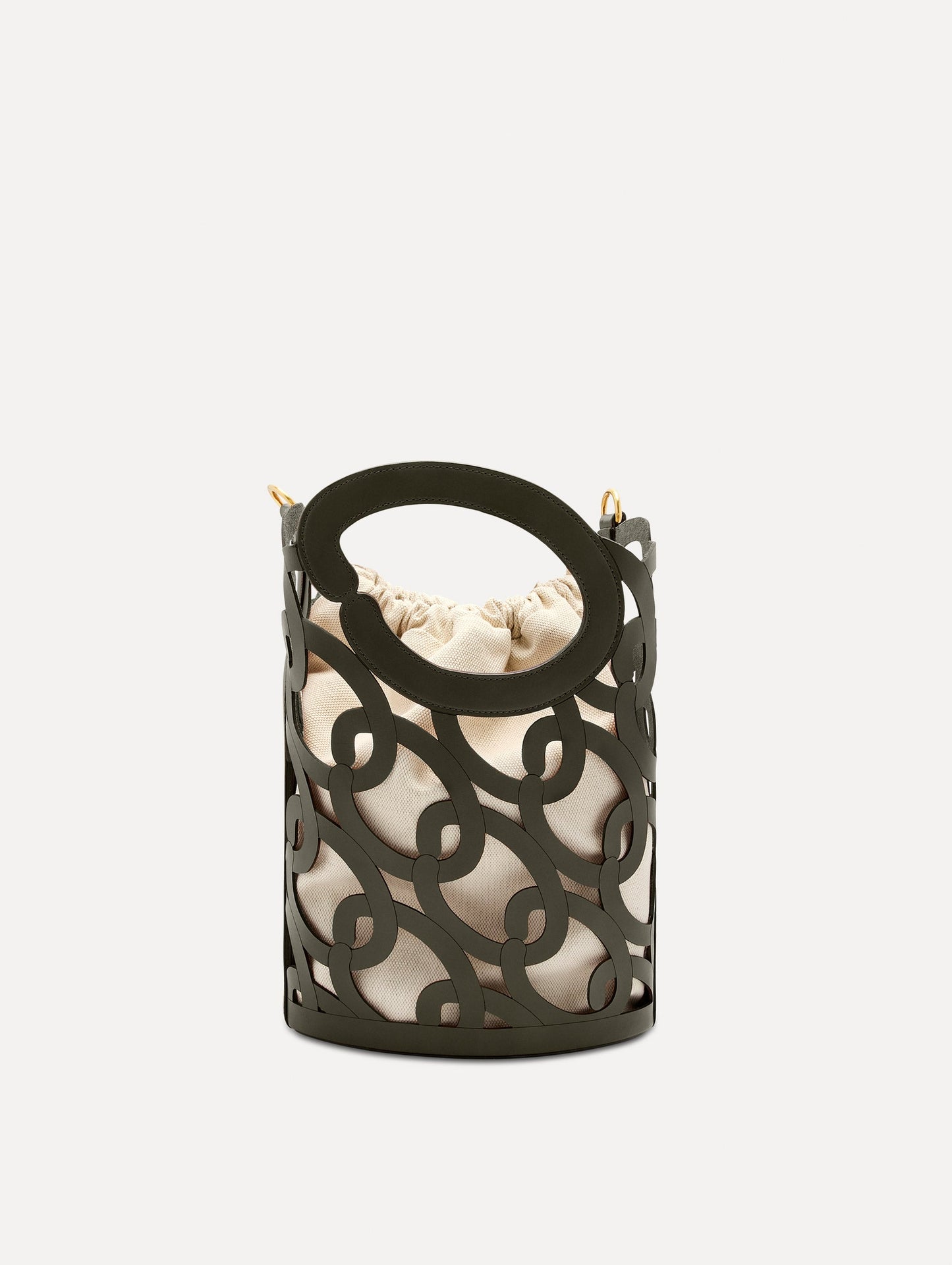 The Oscar chain link bucket tote in olive green with a large o forming the top handle and detachable shoulder strap, paired with an ombre floral dress. Side View.