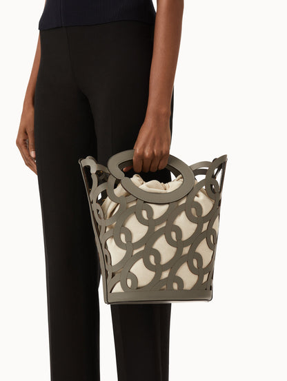 Oscar chain link bucket tote in grey with a large o forming the top handle and detachable shoulder strap. Front View.