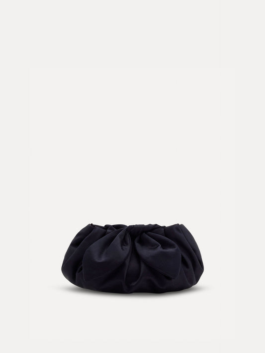 Small satin clutch in taupe with a bow detail on the top. Front View.