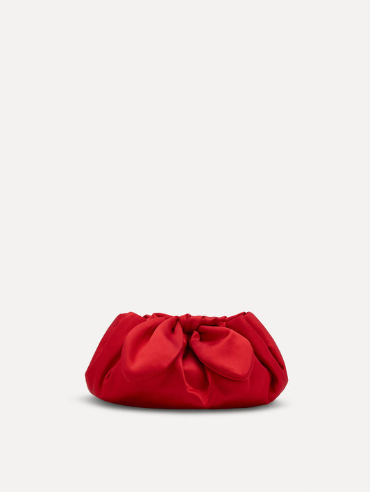 Small satin clutch in taupe with a bow detail on the top. Front View.