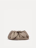 Small satin clutch in taupe with a bow detail on the top. Front View.
