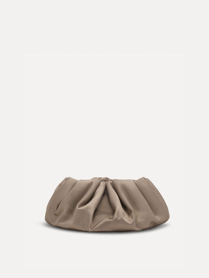Small satin clutch in taupe with a bow detail on the top. Back View.