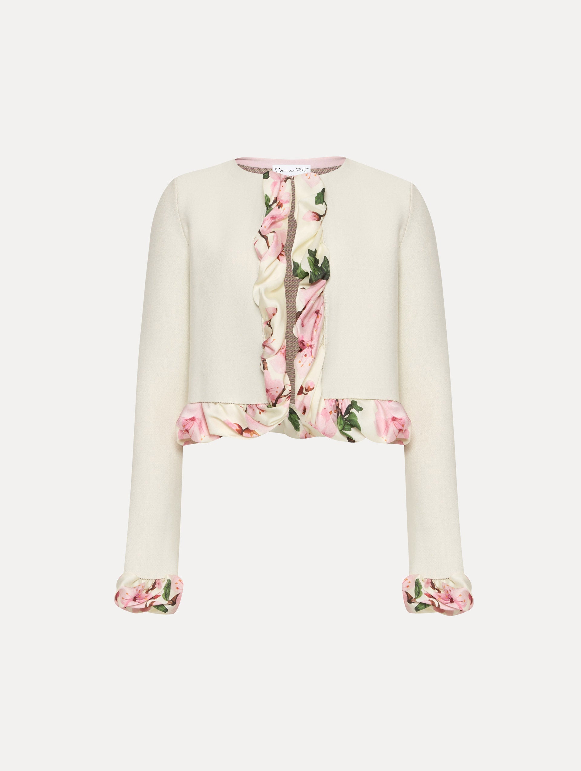 White cardigan with pink bubble twist trim printed with cherry blossoms