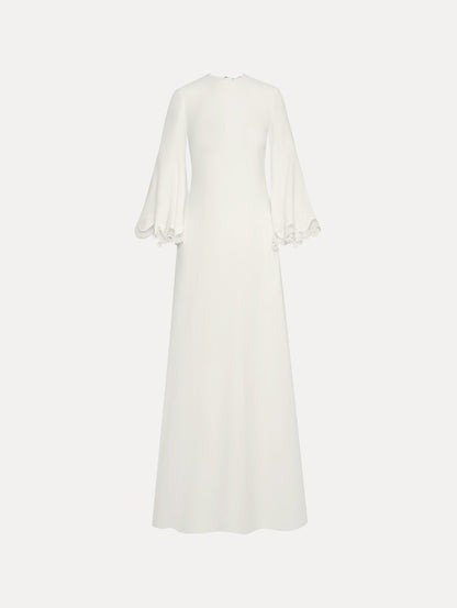 White long sleeve caftan with lace detail on the cuff of the bell sleeve. Front view.