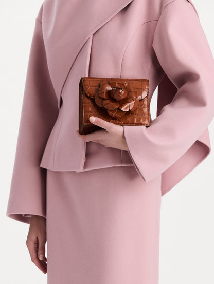The Embossed Mini TRO Bag in the color cognac. Front view.