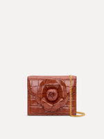 The Embossed Mini TRO Bag in the color cognac. Front view.