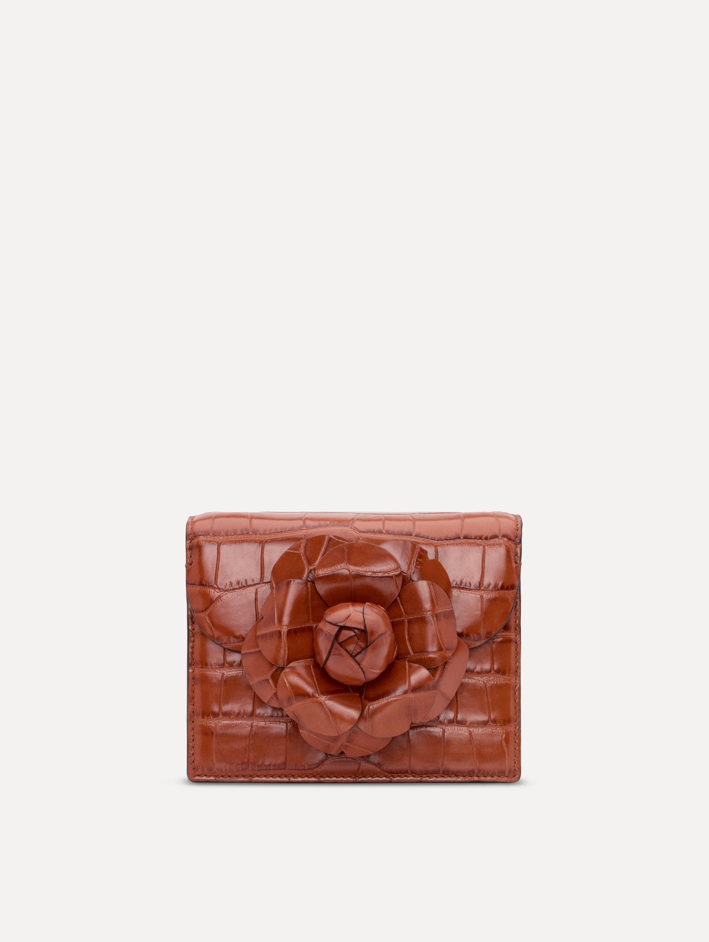 The Embossed Mini TRO Bag in the color cognac. Front view.