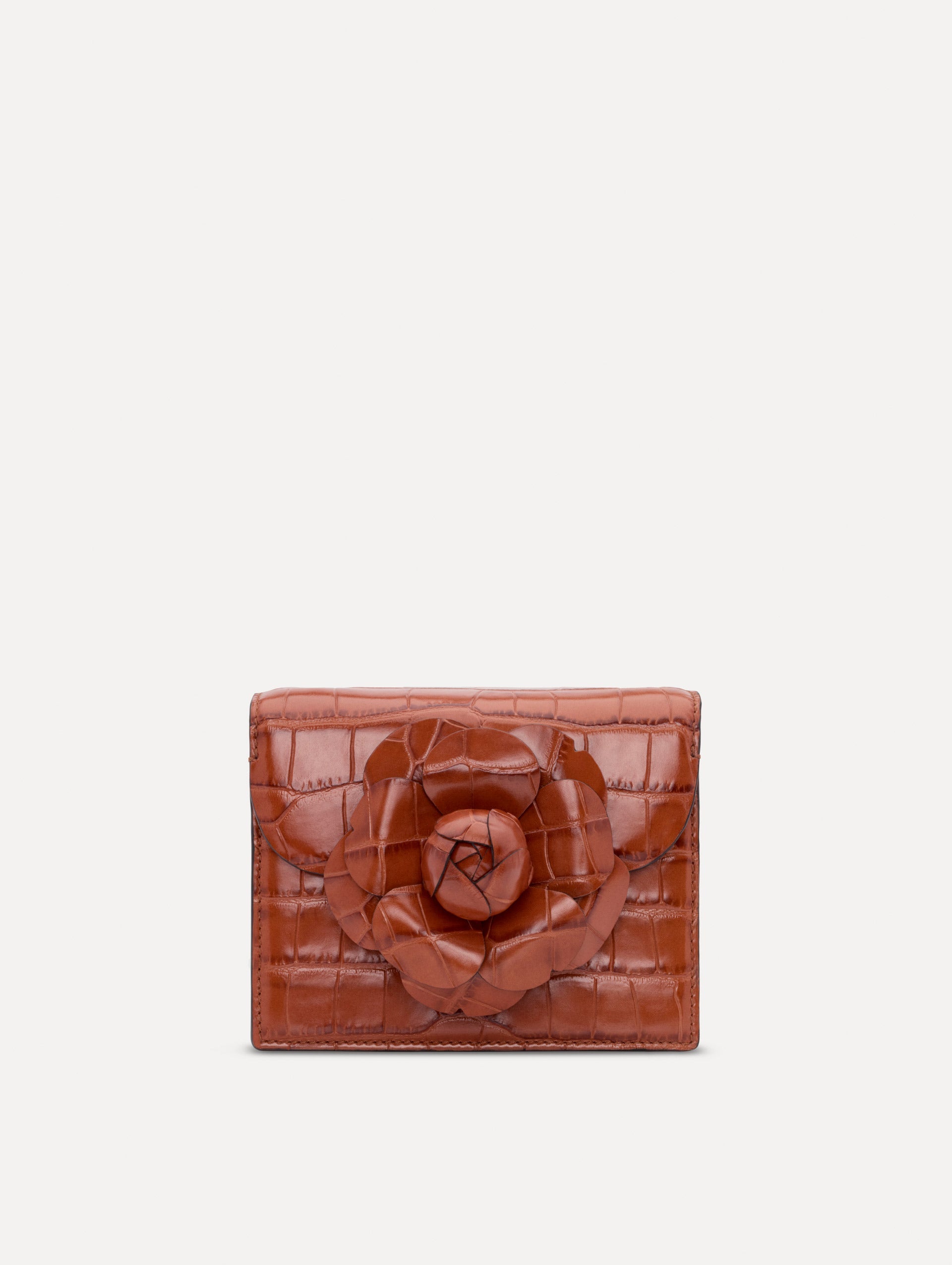 The Embossed Mini TRO Bag in the color cognac. Front view.
