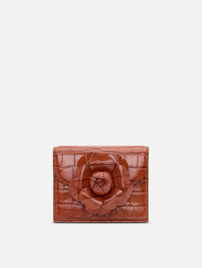 The Embossed Mini TRO Bag in the color cognac. Front view.
