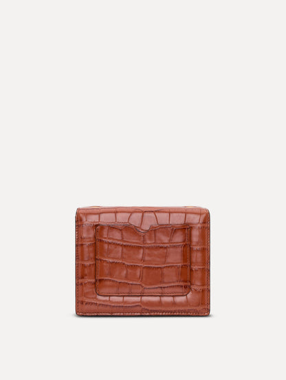The Embossed Mini TRO Bag in the color cognac. Back view.