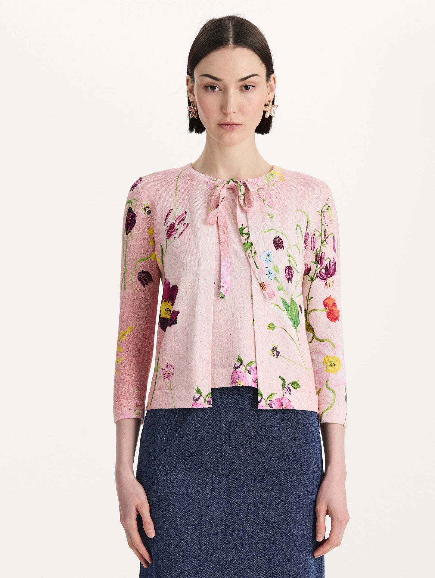 The model is wearing the mixed botanical tie-neck cardigan with an all-over floral print in blush multi. Front view.