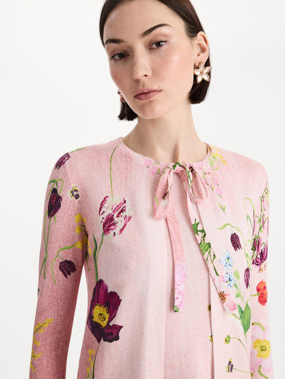 The model is wearing the mixed botanical tie-neck cardigan with an all-over floral print in blush multi. Zoom view.