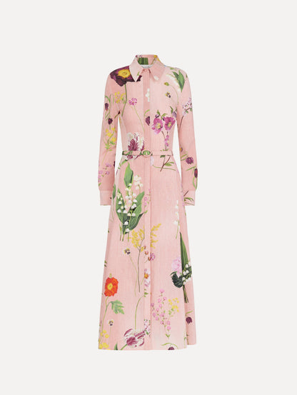 The model is wearing the mixed botanical cotton poplin dress with a collared neckline, long sleeves, and an all-over floral print in blush multi.