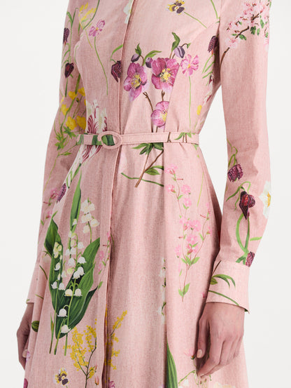 The model is wearing the mixed botanical cotton poplin dress with a collared neckline, long sleeves, and an all-over floral print in blush multi. Zoom view.