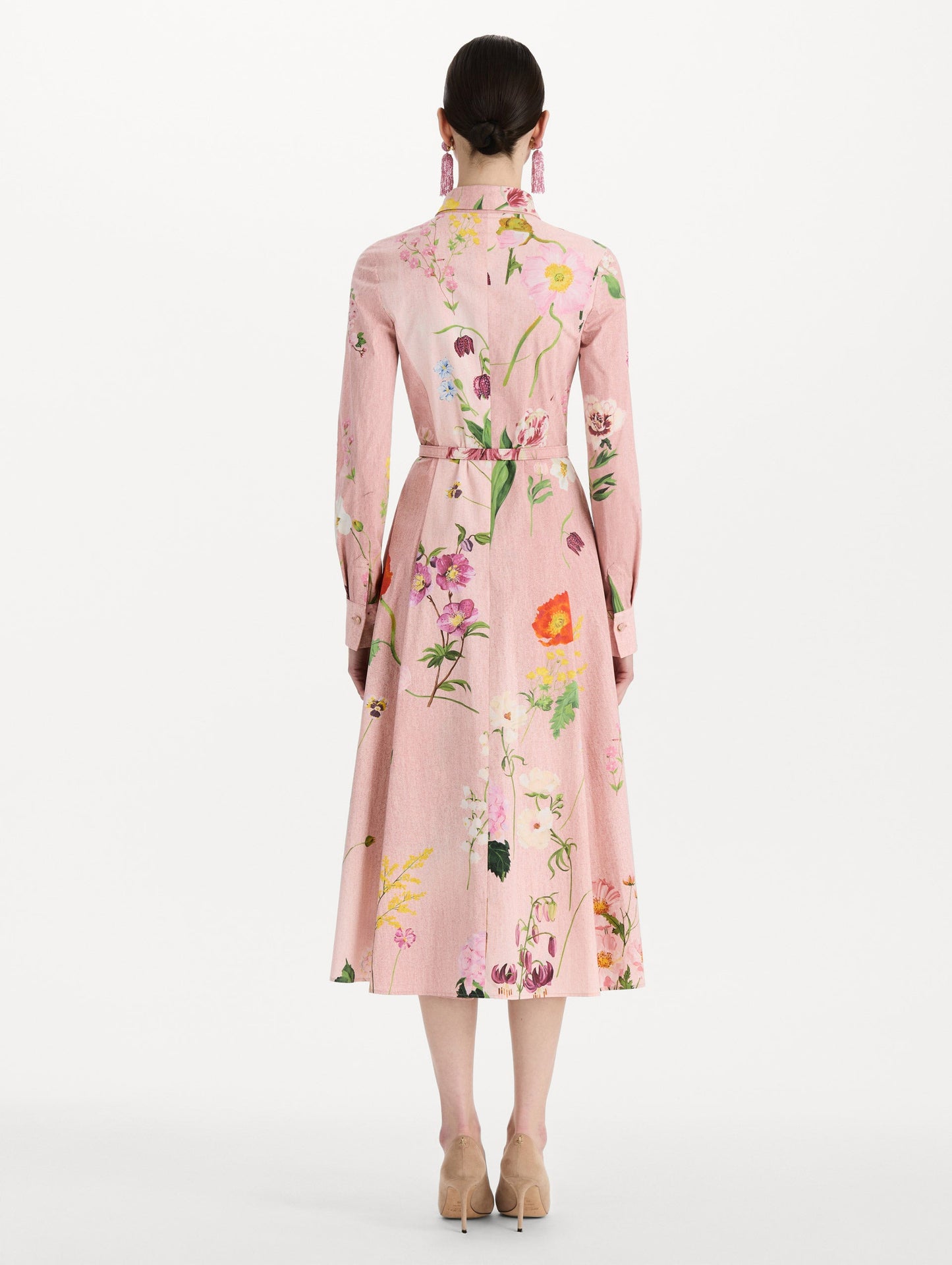The model is wearing the mixed botanical cotton poplin dress with a collared neckline, long sleeves, and an all-over floral print in blush multi. Back view.