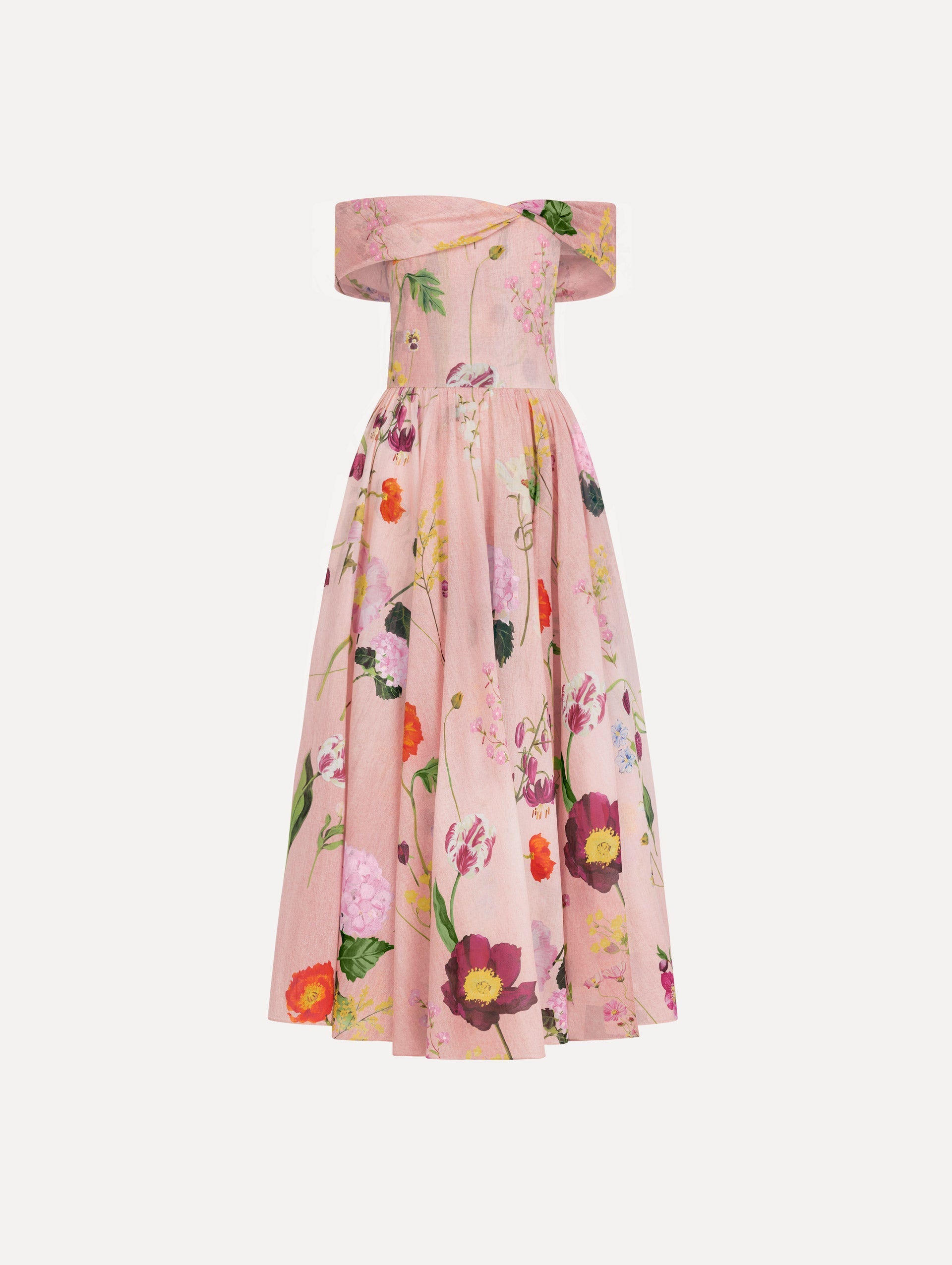 The model is wearing the mixed botanical off-shoulder dress in organic cotton with a floral print in a blush multi palette.