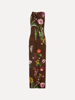 The model is wearing the mixed botanical Milano jersey dress with a sleeveless silhouette in a brown multi palette.