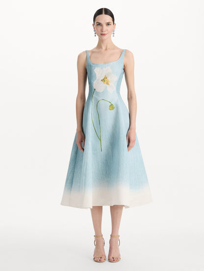 The model is wearing the ombré peony faille dress with a sleeveless scoop neckline in white and blue. Front view.