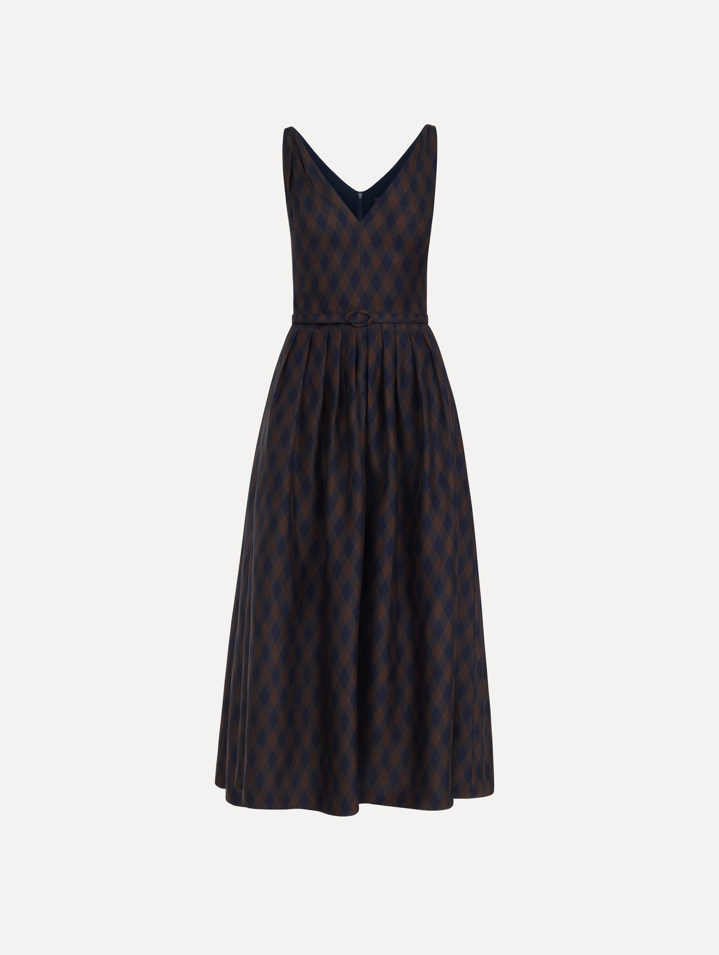 The model is wearing the argyle silk twill dress with a sleeveless silhouette, a V-neckline, and an argyle print in navy and brown.