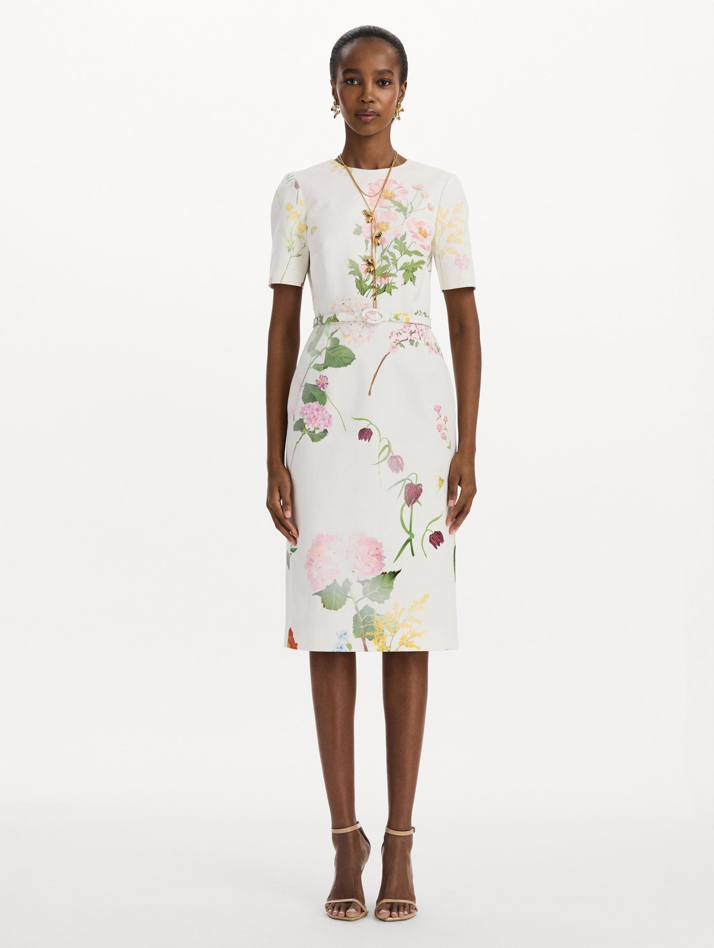 The model is wearing the faded mixed botanical denim dress with midi sleeves and a washed floral print in white multi. Front view.