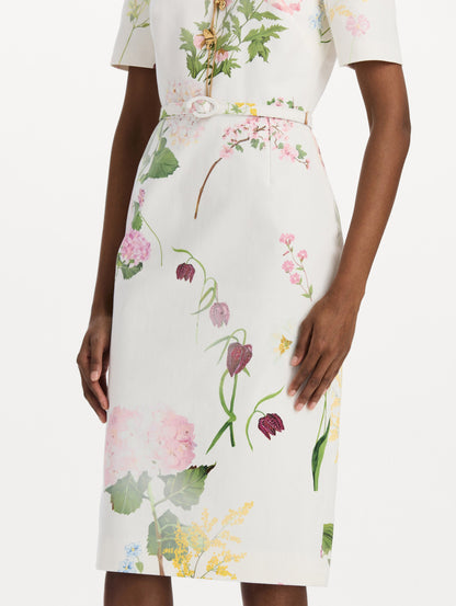 The model is wearing the faded mixed botanical denim dress with midi sleeves and a washed floral print in white multi. Zoom view.
