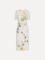 The model is wearing the faded mixed botanical denim dress with midi sleeves and a washed floral print in white multi.