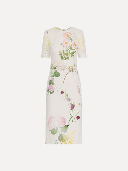 The model is wearing the faded mixed botanical denim dress with midi sleeves and a washed floral print in white multi.
