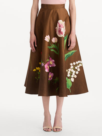 The model is wearing the mixed botanical midi skirt with an all-over floral print in stretch cotton. Front view.