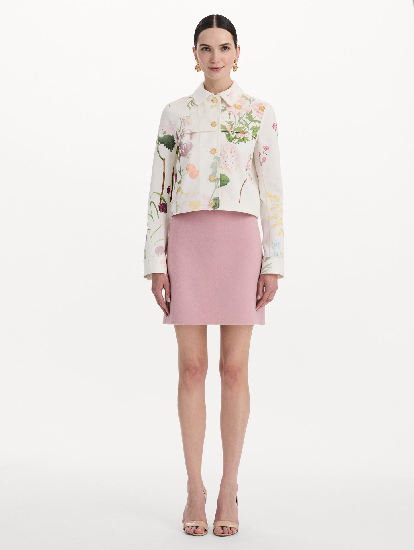 The model is wearing the faded mixed botanical denim jacket in the color white multi. Front view.